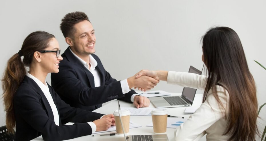 friendly-partners-handshaking-group-meeting-thanking-successful-teamwork-scaled.jpg
